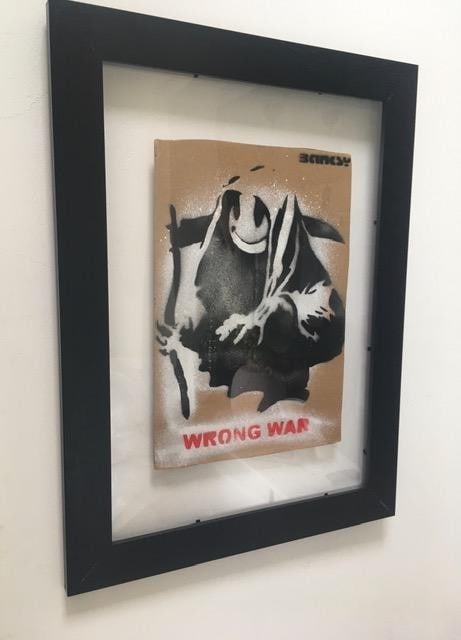 Banksy (b1974) ‘Wrong War’ & 6 Dismaland Bemusement Park Souvenirs Inc Framed Banksy Fre: Title: Banksy (b1974) ‘Wrong War’ & 6 Dismaland Bemusement Park Souvenirs Inc Framed Banksy Free Art, 2015 Description: Banksy (b1974) ‘WRONG WAR’ & Six Dismaland