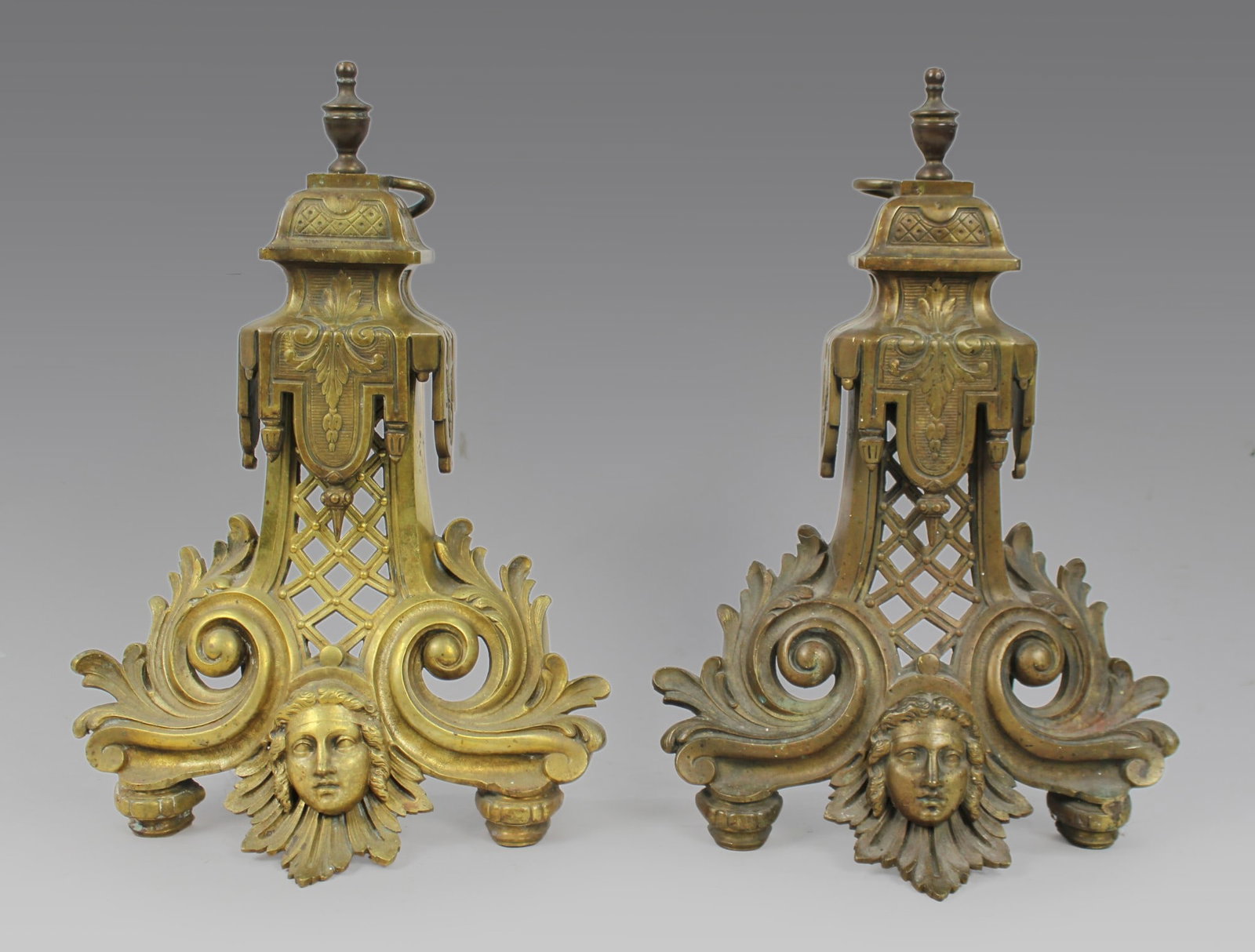 Fine Antique Brass Fire Chenets: Title: Fine Antique Brass Fire Chenets Description: Pair of 19th Century Gilt Bronze Neoclassical Fire Chenets with Mask Detail, c.1860 A fine and weighty pair of 19th century French or English gilt