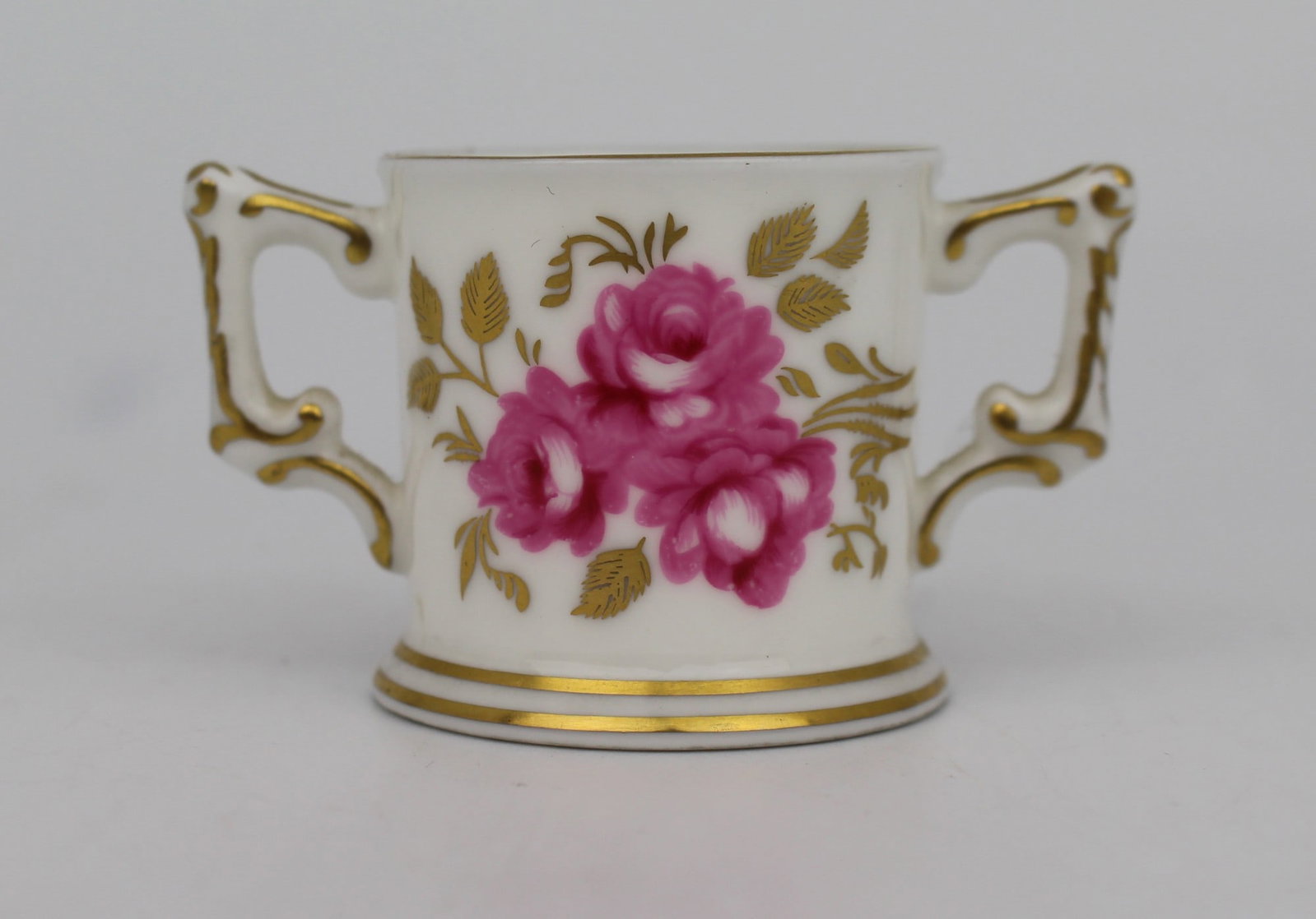 Royal Crown Derby miniature Royal Pinxton Roses Two Handled Cup: Title: Royal Crown Derby miniature Royal Pinxton Roses Two Handled Cup Description: Royal Crown Derby miniature Royal Pinxton Roses Two Handled Cup. Measures 6 x 3.5 x 3.5 (height) cm. Very