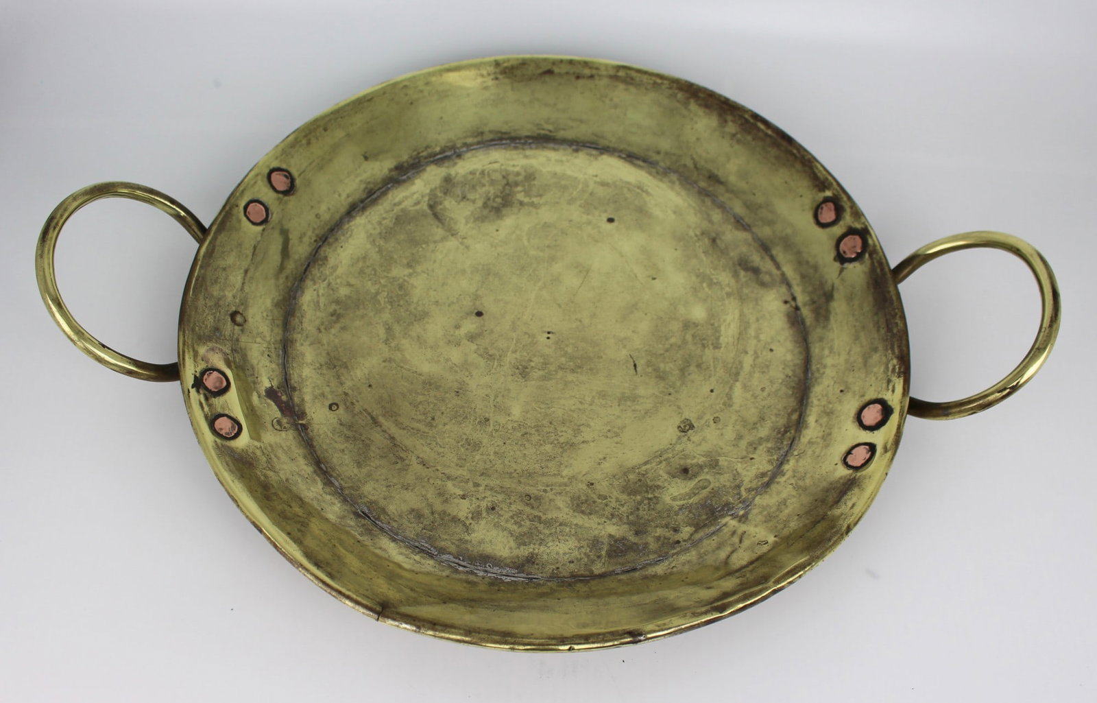 Antique Brass Two Handled Dish: Title: Antique Brass Two Handled Dish Description: Antique Brass Two-Handled Dish – 19th Century A characterful antique brass dish, of shallow oval form with two ring handles. Handmade and