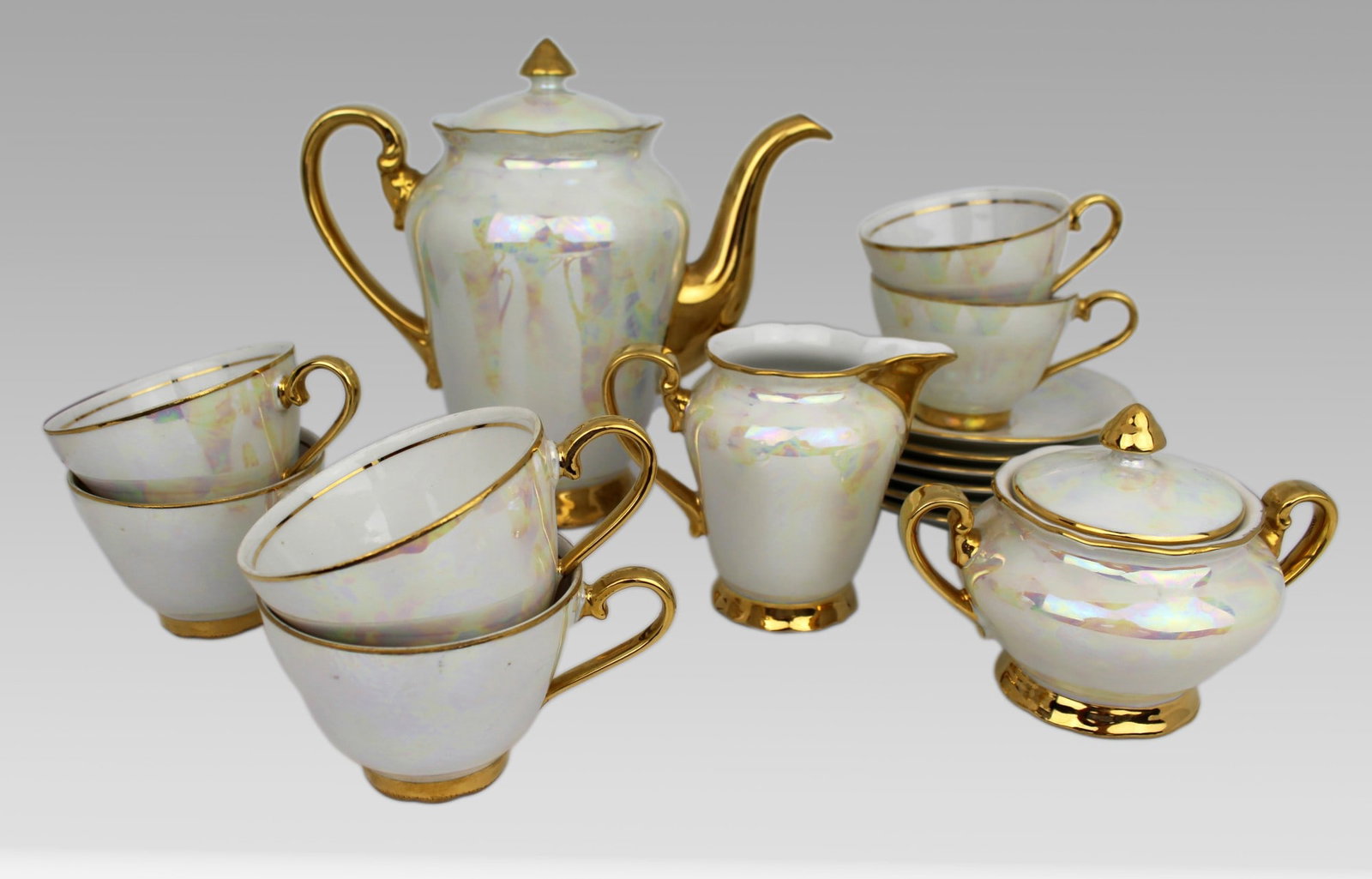 Czech Porcelain Lustre Gilt Tea Service: Title: Czech Porcelain Lustre Gilt Tea Service Description: Czech Porcelain Lustre Gilt Tea Service Czech lustre & gilt. All pieces pictured; tea cup, 6 tea cups & saucers, cream jug, lidded