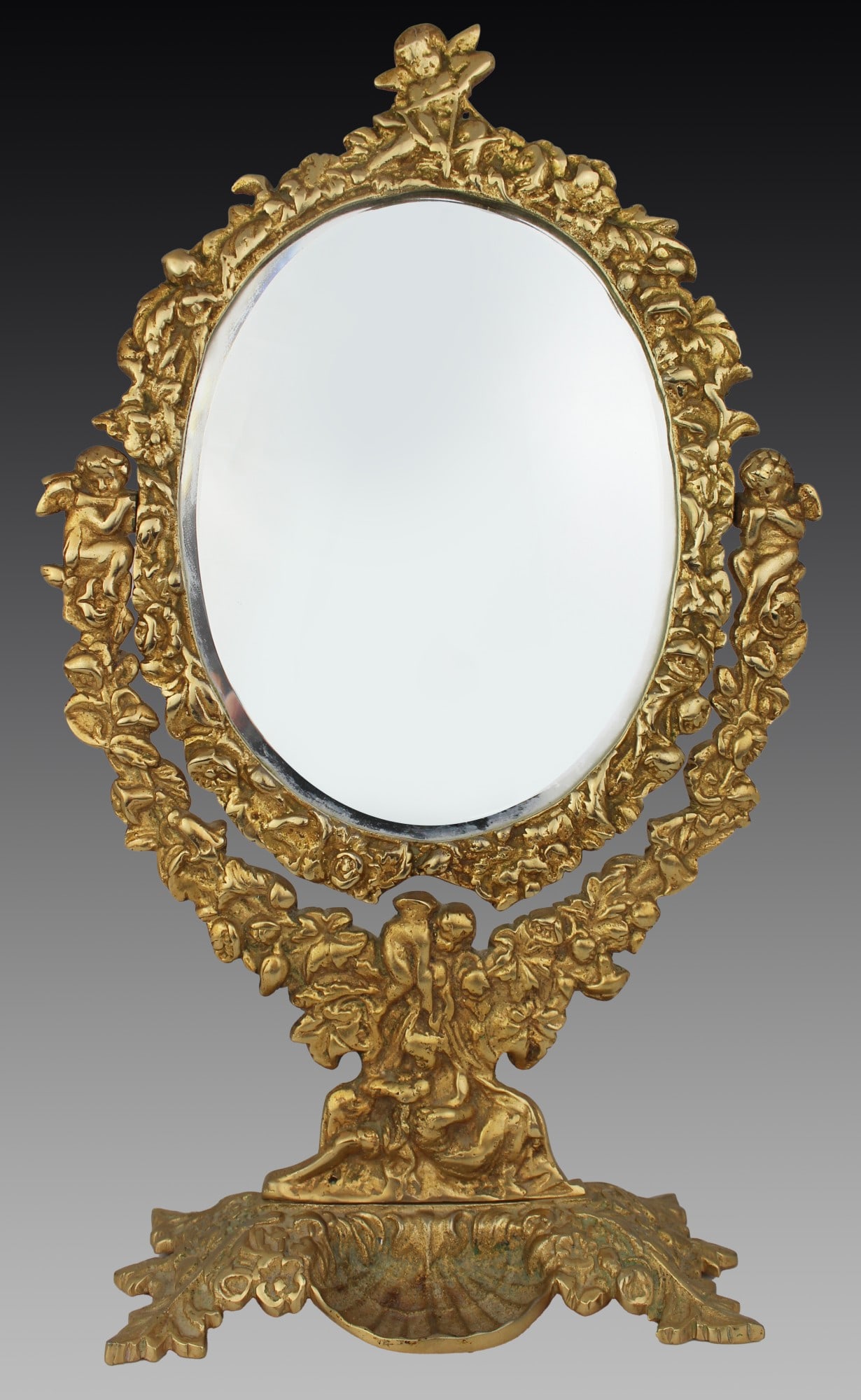 Ornate Vintage Brass Cherub Vanity Table Mirror: Title: Ornate Vintage Brass Cherub Vanity Table Mirror Description: Vintage Gilt Brass Cherub Vanity Mirror, Mid to Late 20th Century Charming vintage gilt brass dressing table mirror feat