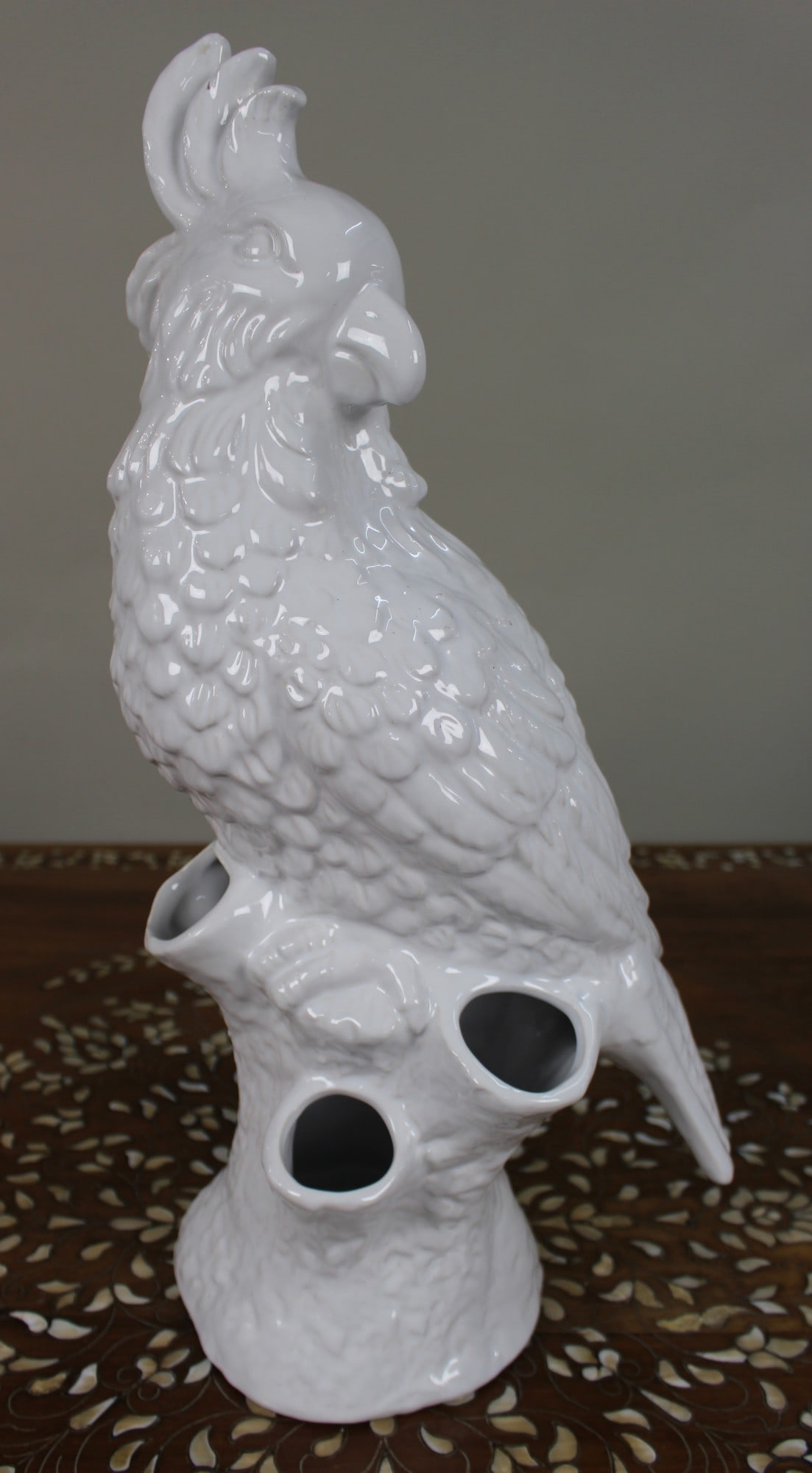 Large White Glazed Ceramic Parrot Sculpture: Title: Large White Glazed Ceramic Parrot Sculpture Description: Large White Glazed Ceramic Parrot Sculpture A bold contemporary ceramic sculpture of a parrot, finished in a glossy white glaze. The