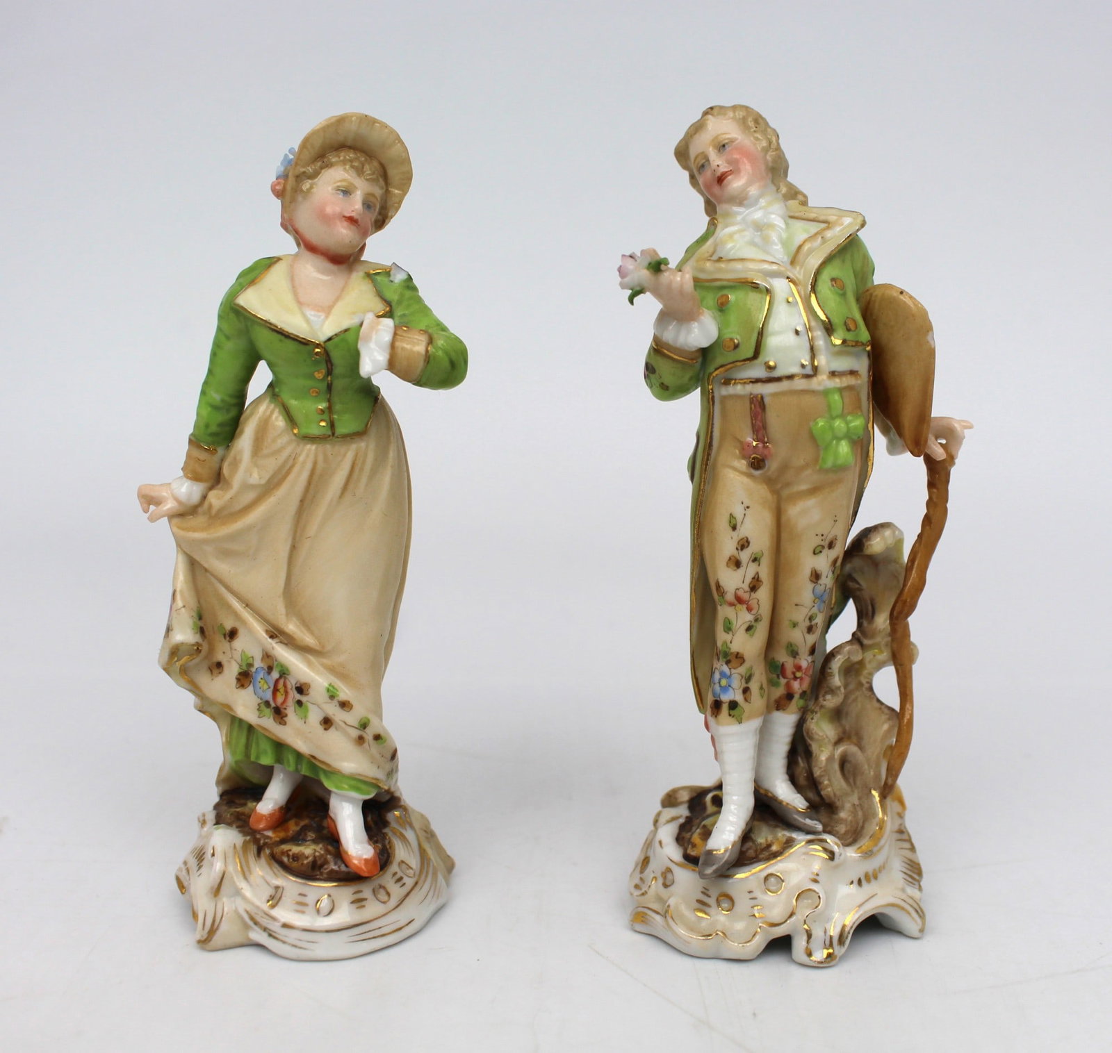 Pair of Continental Porcelain Figurines: Title: Pair of Continental Porcelain Figurines Description: Pair of Vintage German Porcelain Figurines Pair of old German porcelain figurines. Hand made and hand decorated with fine de