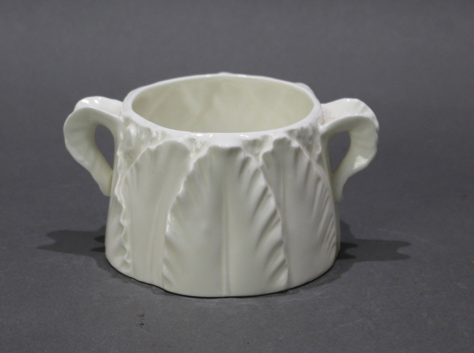 Royal Worcester Two Handled Leaf Jug: Title: Royal Worcester Two Handled Leaf Jug Description: Royal Worcester porcelain. 1960's. Measures 12 x 9 x 6 (h) cm. Full first quality green factory mark to underside. Very good condition; no