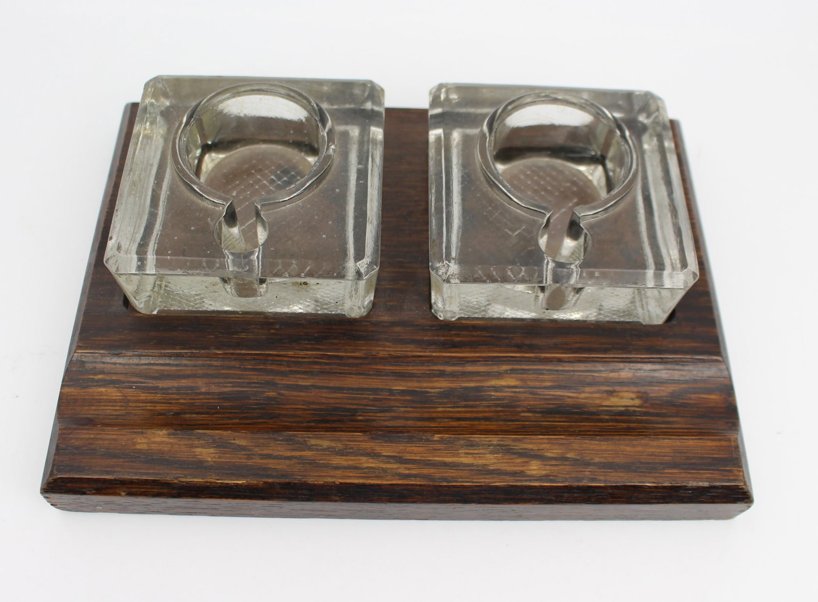 Early 20th Century Double Inkwell on Wooden Stand: Title: Early 20th Century Double Inkwell on Wooden Stand Description: Early 20th Century Double Inkwell on Wooden Stand A smart and practical writing desk accessory, featuring two clear glass