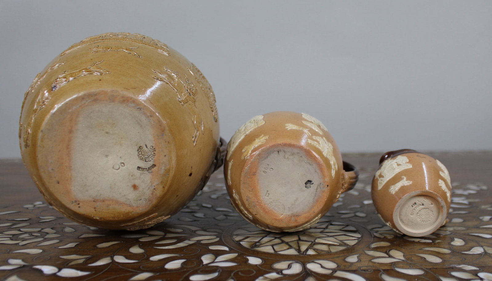 Collection of Three Graduated Doulton Lambeth Stoneware Jugs, c.1900 - 5