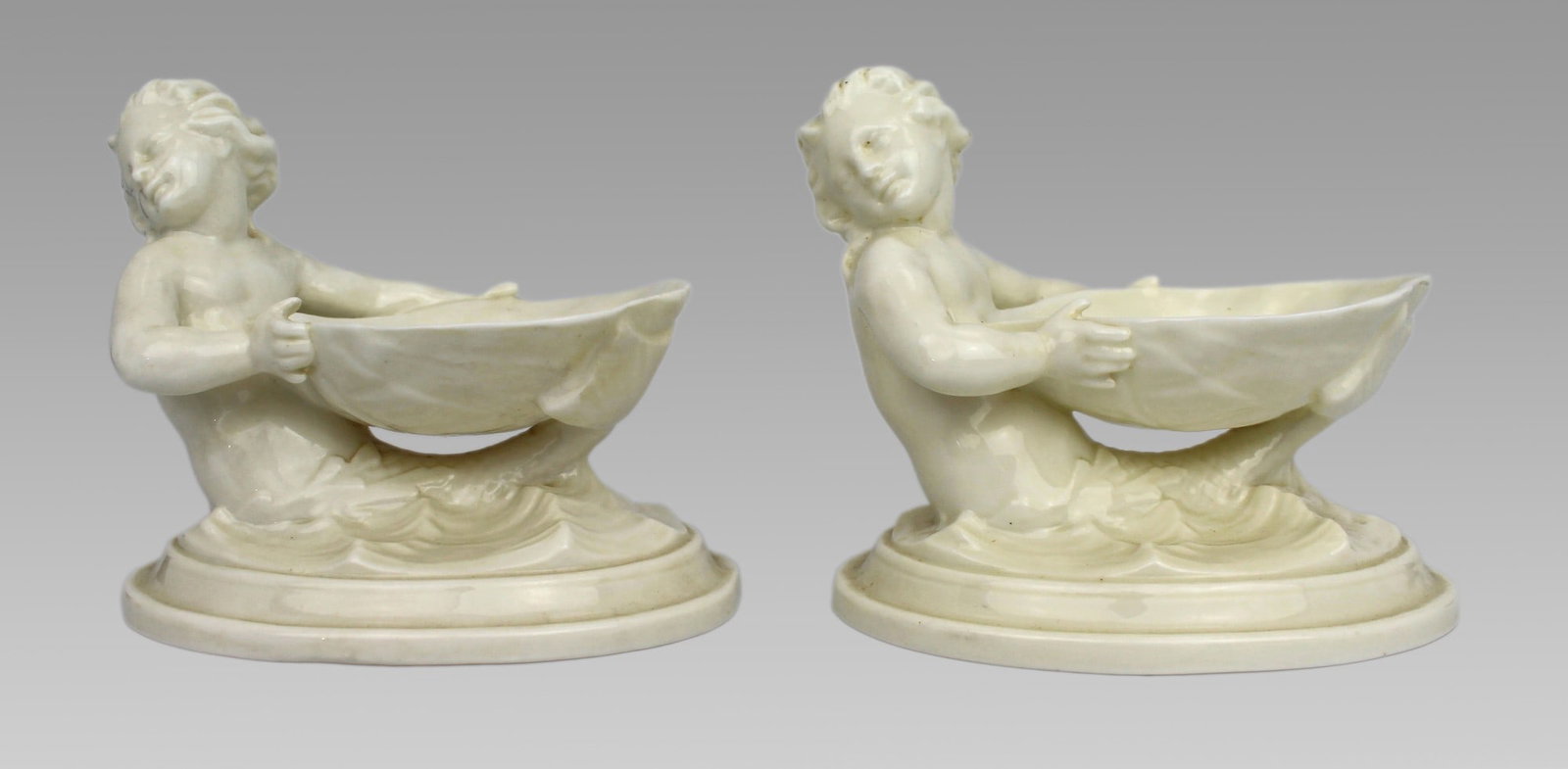 Pair of Royal Worcester Blanc de Chine Merchild Salt Cellars: Title: Pair of Royal Worcester Blanc de Chine Merchild Salt Cellars Description: Pair of Royal Worcester Blanc de Chine Merchild Salt Cellars, Model 349, England, 1962–63 Description: A