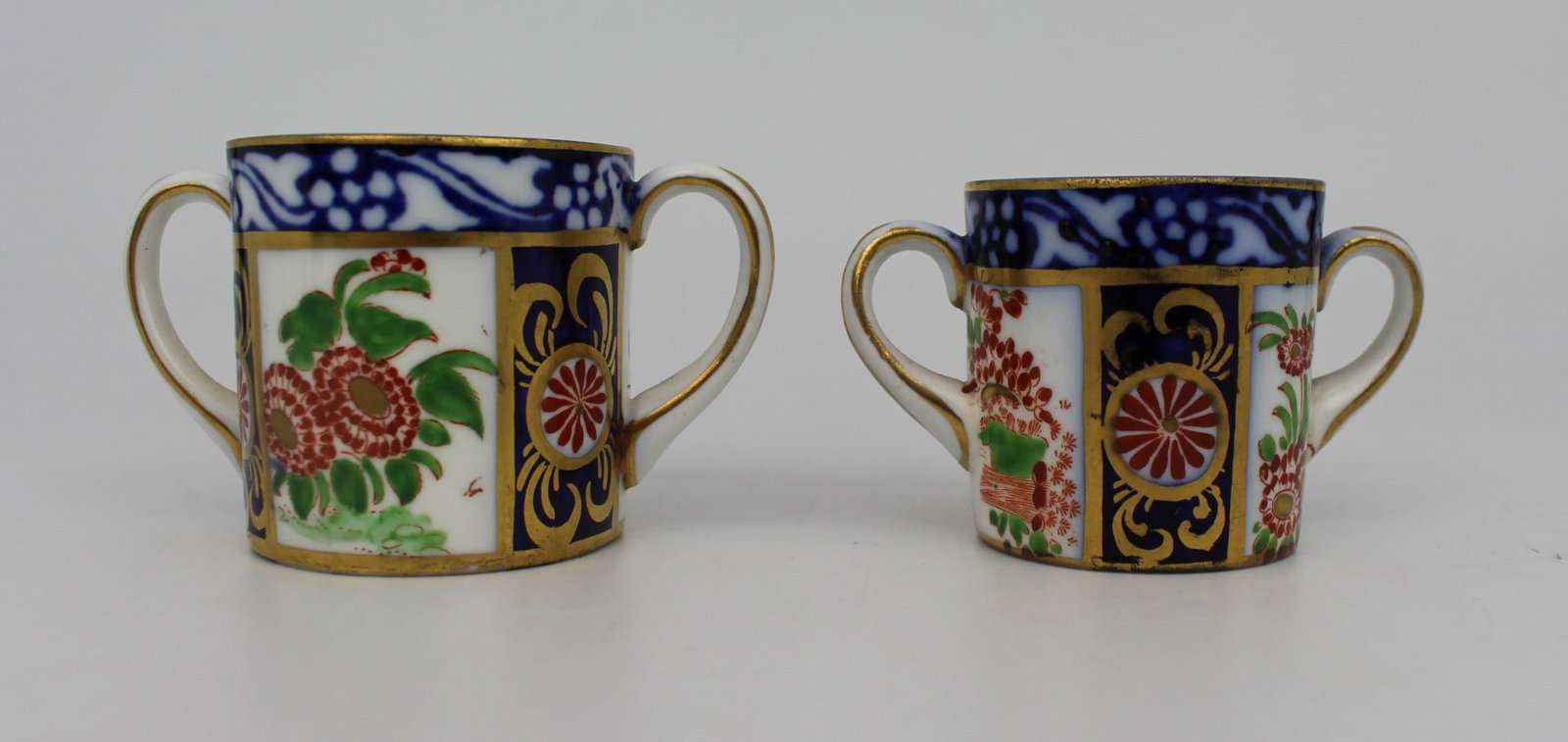 Pair of New Chelsea Staffs Miniature Two Handled Cups c.1920: Title: Pair of New Chelsea Staffs Miniature Two Handled Cups c.1920 Description: Pair of New Chelsea Staffordshire Miniature Two-Handled Cups | c.1920 A graduated pair of miniature two-handled cups,