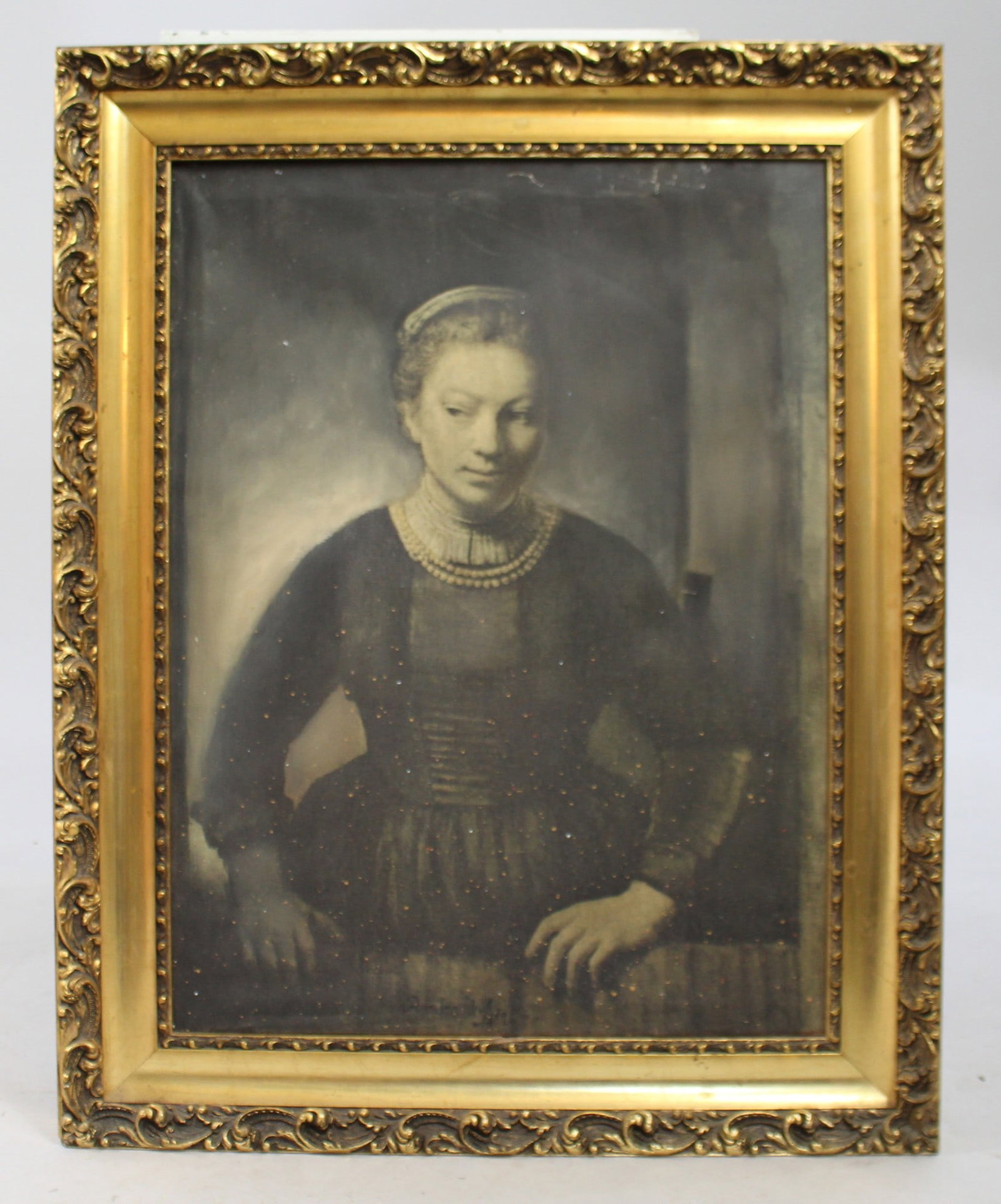 Rembrandt print on canvas: Title: Rembrandt print on canvas Description: Rembrandt print on canvas. Set in heavy gilt frame. Frame measures 59 x 74 .5 cm. Some paint speckling and ripples to canvas. Frame in good condition.