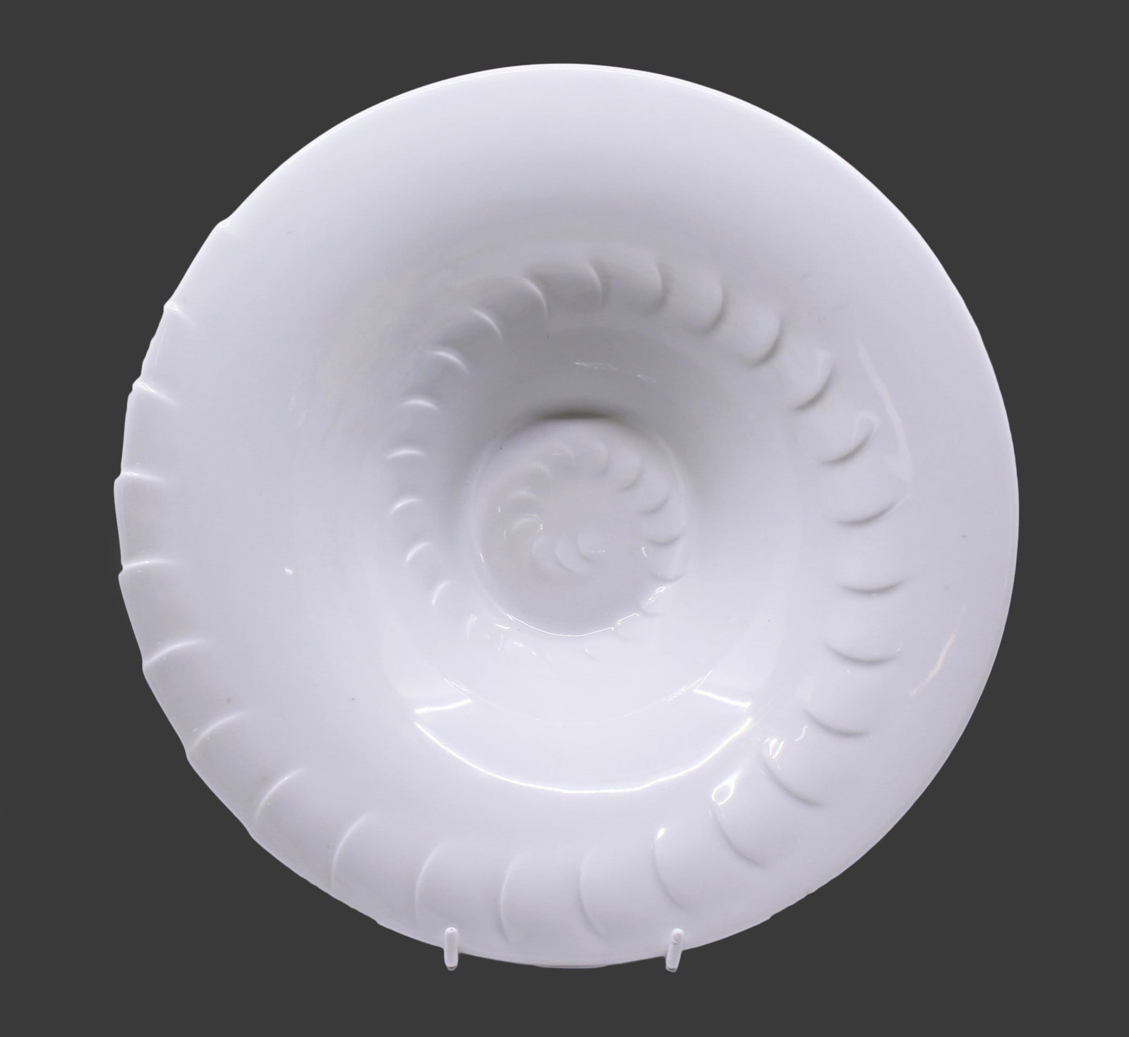 Royal Worcester Bowl Last Factory Piece: Title: Royal Worcester Bowl Last Factory Piece Description: Item: White porcelain bowl on a raised foot Design: Spiral shell-like moulded pattern, elegantly minimal in pure white Backstamp: Features