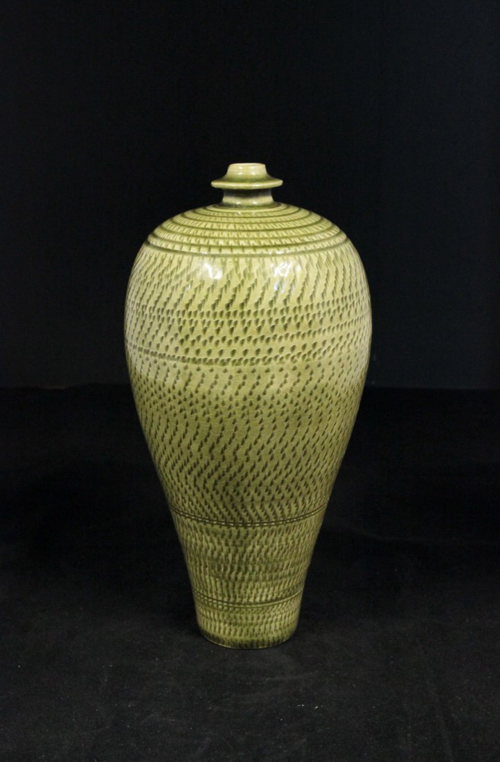 Exquisite Song Dynasty Yiuzhou-Yao Celadon Meiping: Diameter of mouth 0.75 in., H 11 in. This was a celadon meiping of the Song Dynasty (960-1279). It was decorated with geometrical and spiral patterns all over the body. This was a simple design but ve