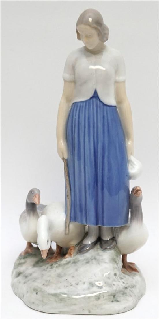 BING & GRONDAHL PORCELAIN GOOSE GIRL: Vintage Bing & Grondahl, Denmark Porcelain Girl with Geese Figurine #2254. Large porcelain grouping of a young woman with three geese. She is carrying a stick and a bag of food. This work is by the sc