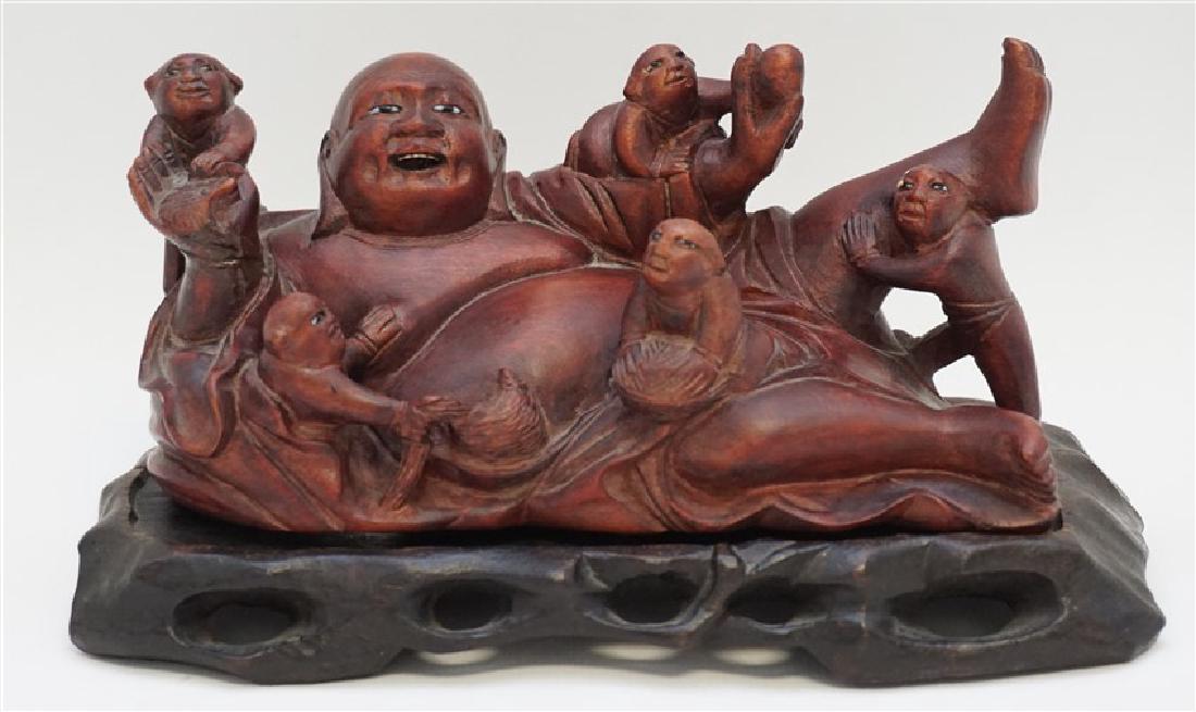 CARVED WOOD LAUGHING BUDDHA W STAND: Laughing Reclining Buddha Wood Carving with Glass Eyes and Teeth With 5 children on custom wood carved stand. Derived from Buddha Maitreya, the Buddha of the future, full of abundance and good will, g