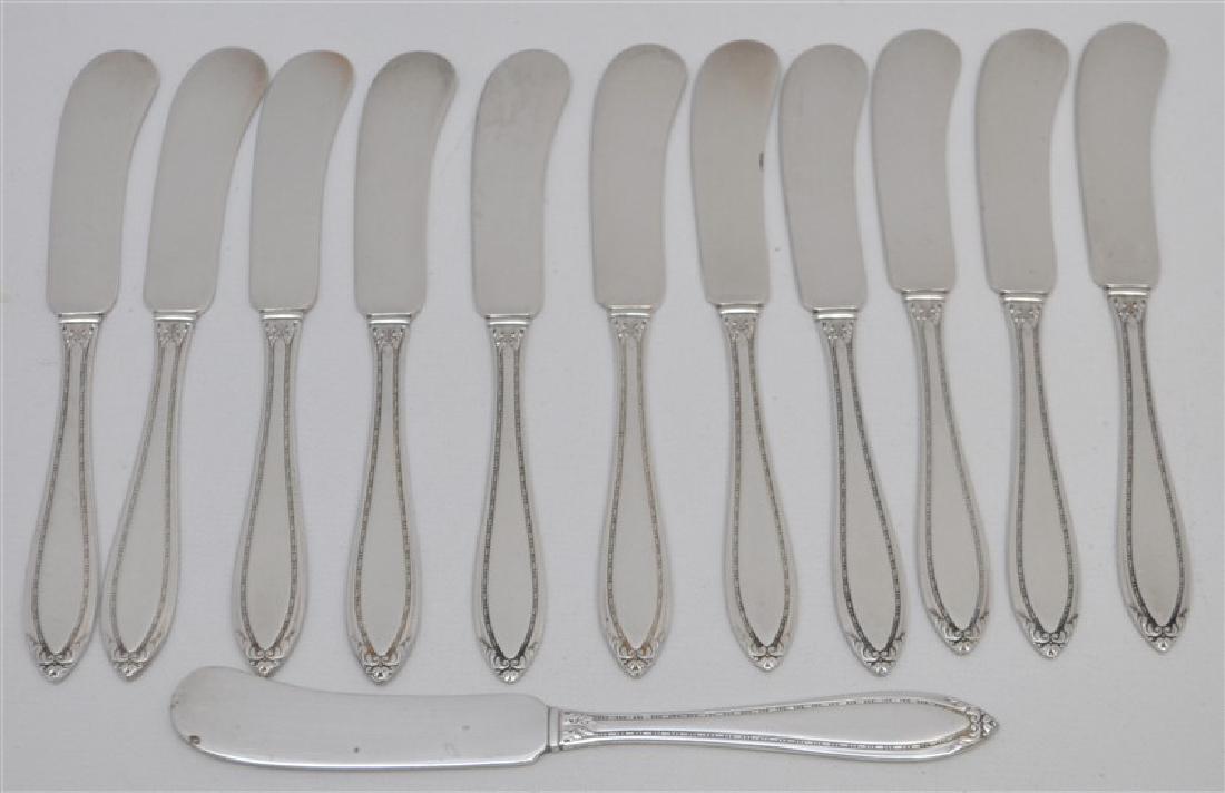 12 STERLING SILVER BUTTER PADDLES - LADY BETTY: 12 Sterling Silver Flat Handle Butter Paddles in the Lady Betty Pattern c. 1920 by International Silver. No Monograms. Each measures 5 1/2" long. Weight is 265 grams. PROVENANCE: A Charleston SC Priva