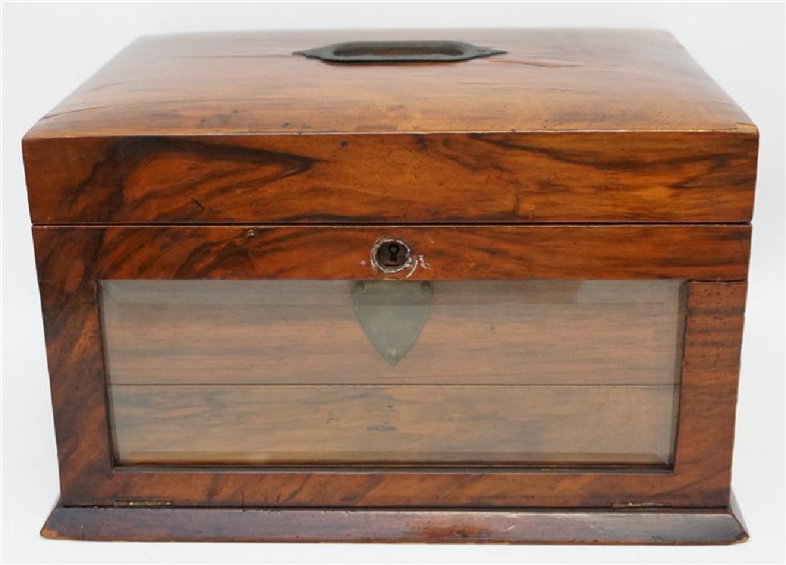 ENGLISH VICTORIAN WOOD JEWELRY BOX: Victorian English wooden jewelry box with green tufted silk fitted interior, including a beveled mirror in the top, beveled glass front drop front which opens to two small drawers, locks but missing k