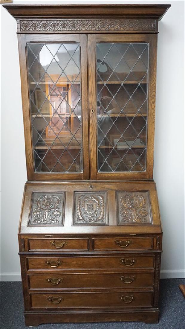 ETHAN ALLEN ENGLISH SECRETARY / BOOKCASE: Vintage Ethan Allen Solid Oak English Jacobean Secretary Bookcase from the Royal Charter Collection. Two locking leaded glass doors with four shelf interior over a drop front desk with heavily carved