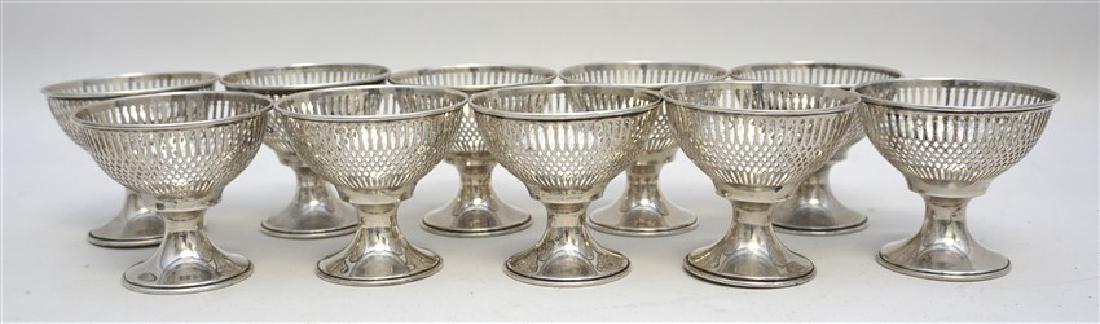 10 STERLING SILVER SHERBET HOLDERS - WHITING: Set of Ten Sterling Silver Frank M. Whiting Pierced Sherbet Holders. Pierced, each measures 2.75"x2.75"x2.50". Weight is 280 grams. PROVENANCE: A Charleston SC Private Estate.