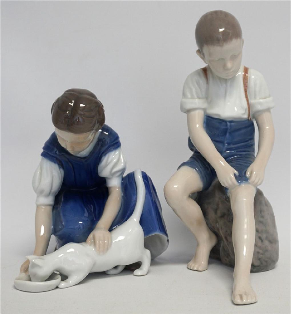 2 PC BING & GRONDAHL GIRL w CAT & BOY ON ROCK: Two Vintage Bing & Grondahl, Denmark Porcelain Figurines. Both are discontinued, in very good condition and nicely sized. The Boy on Rock (Wading Boy) is B&G #1757 and measures approximately 7 3/4 tal