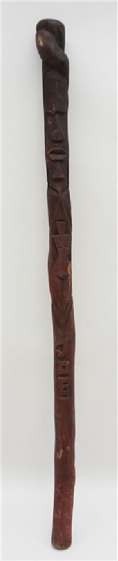 AMERICAN FOLK ART WALKING STICK "JOE": American Folk Art Walking Stick with carved entwined snake, mans face and stylized nude woman, with Joe carved below. From a Georgetown, SC Private Estate. Measures 35.50" long. Weight is 1 Pd and 9 o