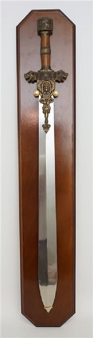 MADE IN SPAIN PERSIAN CEREMONIAL SWORD: Old New Stock. Ornate Persian or Far Eastern Ceremonial Sword Replica. Made in Spain with wood plaque for display. Sword 32". Wood Plaque 36". Weight 7 pds.