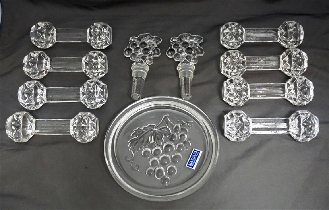 11 pc WATERFORD & GLASS KNIFE RESTS: 3 Waterford Marquis Wine Accessories, 2 Wine Stoppers 4.25" and 1 Wine Coaster 5.25"x5.25". In addition there are 8 glass knife rests each 4.25" long, maker unknown. All in good condition. Weight on a