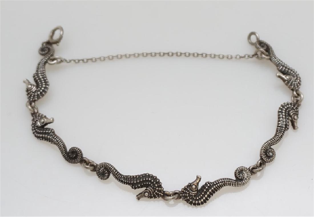 CARL SCHON STERLING SEAHORSE BRACELET: Vintage 1920-1930 Carl Schon Figural Seahorse Sterling Silver Bracelet. Crafted by Baltimore, MD artist Carl Schon. Measures 7" opened, safety Chain. Weight is 10.90 grams. Carl Schon worked primarily