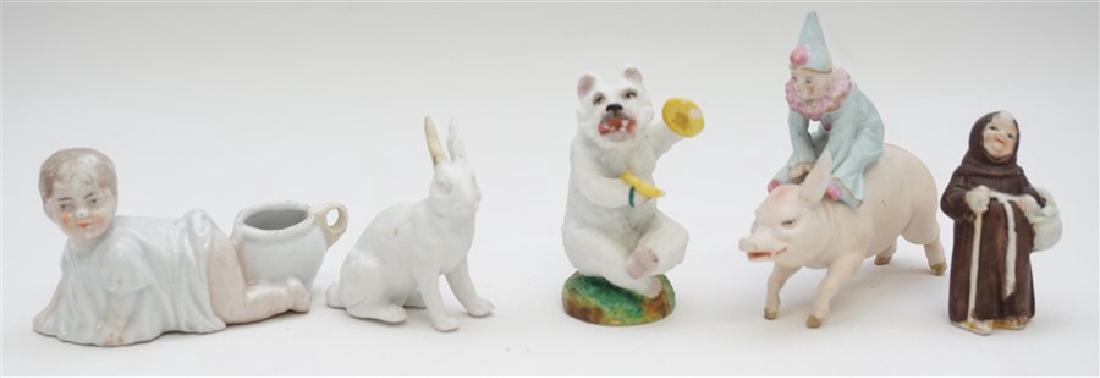 5 ANTIQUE / VINTAGE PORCELAIN ITEMS: 1- Bisque Bear with cymbals marked CF inside 2.75". 2- Bisque Rabbit 2.25". 3- Monk 2". 4- Potty Baby 3.25" long. 5- Clown on pig, pig missing 1 ear, 3" tall. Weight all 8 oz.