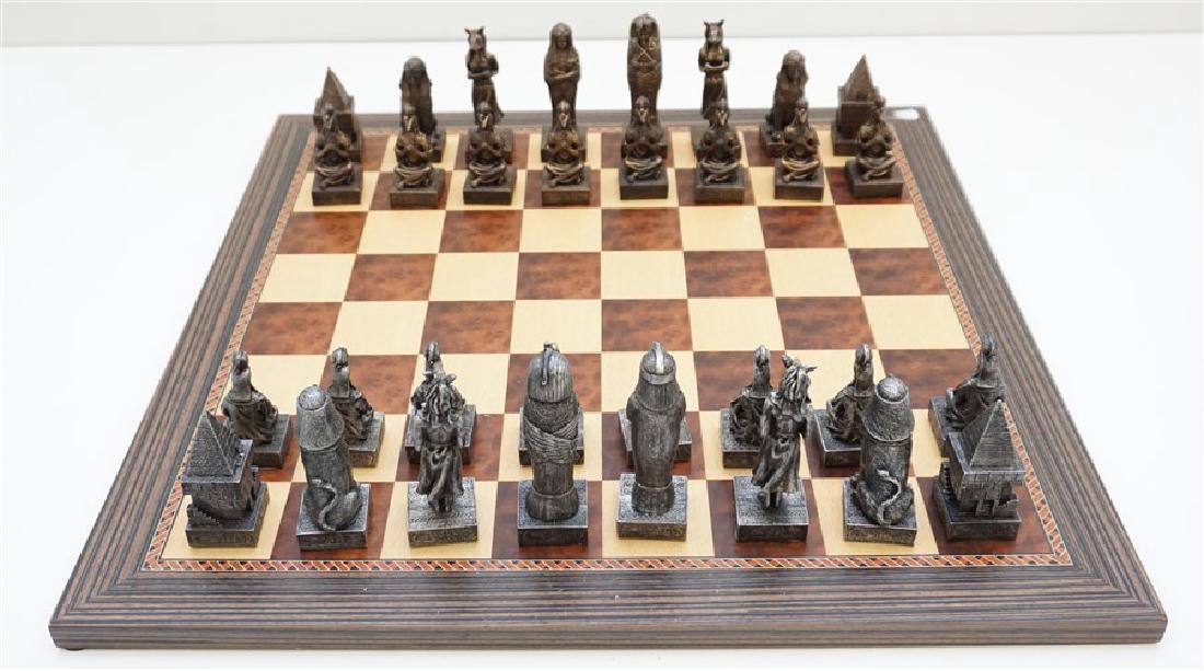 NEW EGYPTIAN DESIGN CHESS SET: New Old Stock Ancient Egypt Designed Chess Set. New and unused. Perfect as a gift. Wood Chess Board measures 19"x19"x.50". With chess pieces and board 19"x19"x4" in box. Weight 11 pds.