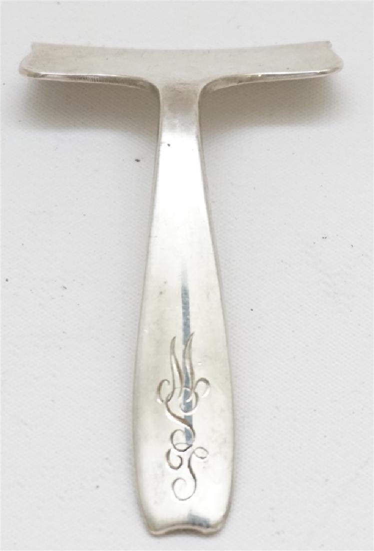TIFFANY & CO STERLING BABY FOOD PUSHER: A Vintage Tiffany & Co. Solid Sterling Silver Baby Food Pusher. Made 1907-1947 (John C. Moore period). Measures 1.75"x2.75. Monogrammed LSW. Weight is 25 grams. PROVENANCE: A Charleston SC Private Est