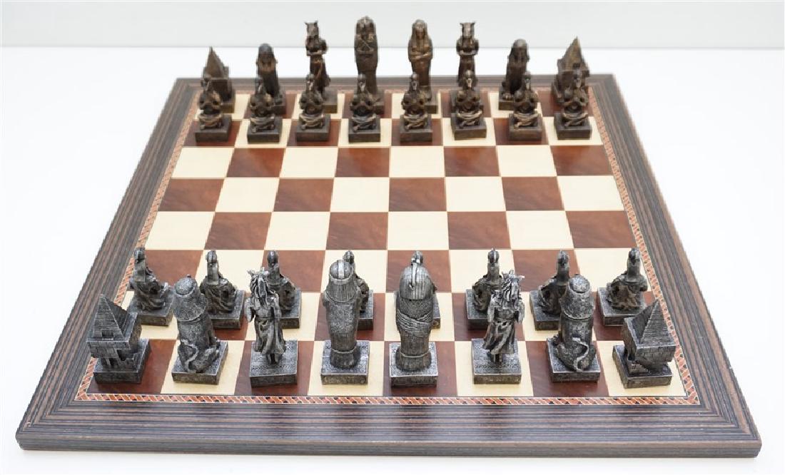 NEW EGYPTIAN DESIGN CHESS SET: New Old Stock Ancient Egypt Designed Chess Set. New and unused. Perfect as a gift. Wood Chess Board measures 19"x19"x.50". With chess pieces and board 19"x19"x4" in box. Weight 11 pds.