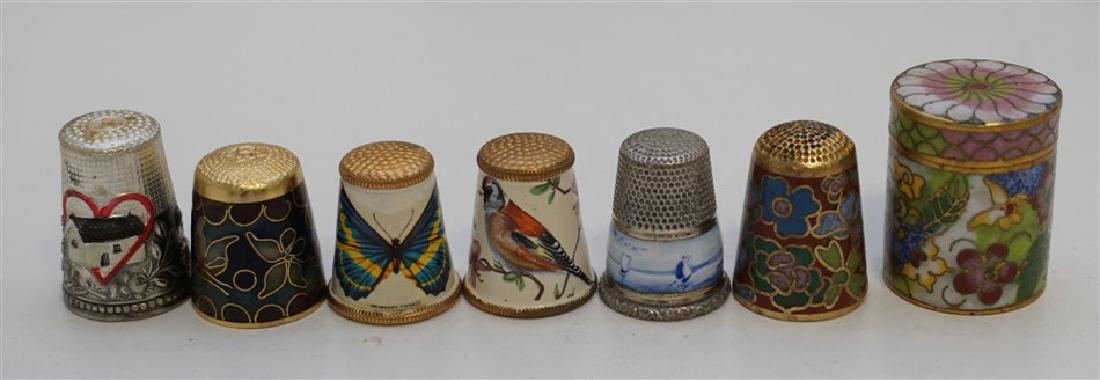 6 VINTAGE ENAMELED THIMBLES: Six Vintage Collectible Enameled Thimbles. Two are Chinese Cloisonne, one in its own case. 1 Delft, 2 Butterfly and Bird Austria, and one Heart and Home. Weight 2 oz.