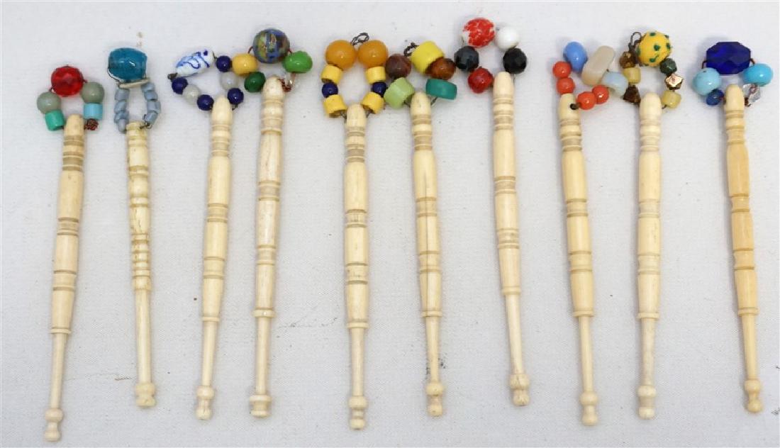 10 ASSORTED ENGLISH TURNED BONE LACE BOBBINS: Ten Assorted Antique English Victorian Turned Bone Decorated Lace Bobbins. All in good condition and each measures approximately 4" long. Decorated with glass beads. Start or add to a collection. Weig