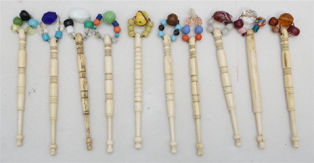 10 ASSORTED ENGLISH TURNED BONE LACE BOBBINS: Ten Assorted Antique English Victorian Turned Bone Decorated Lace Bobbins. All in good condition and each measures approximately 4" long. Decorated with glass beads. Start or add to a collection. Weig