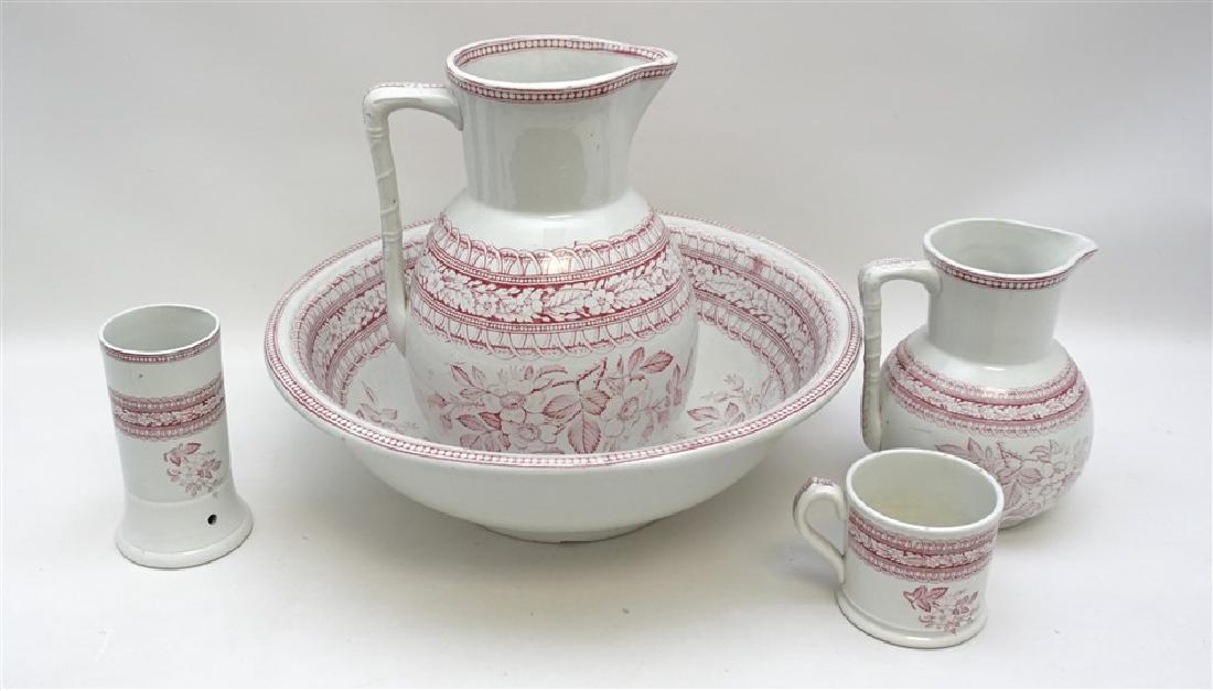 6 pc VICTORIAN WASH STAND SET: Six Piece Red Transfer 19th c Victorian Washstand Set. 1- Wash Basin 15"x15"x5", foot chipped. 2- Wash Pitcher 8"x8"x11". 3- Water Pitcher 6"x6"x7". 4- Shaving Mug 4.50"x3.50"x3.25". 5- Tooth Brush 3.