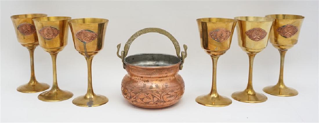 7 pc TURKISH BRASS & COPPER WINES & POT: Six Vintage Turkish Brass and Copper Wine Glasses. Each glass measures 2.75"x2.75"x6" tall. In addition there is a copper hand hammered pot with brass forged handle that measures 4.50"x4.30"x3" tall. 