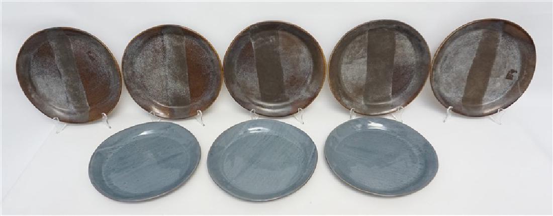 8PC ALEX MARSHALL STUDIOS POTTERY PLATES: Eight Hand Formed and Glazed Alex Marshall Studios Dinner Plates. Good Condition, each 10". All are signed. Weight on all 12 pds 3 oz. Alex grew up in New Jersey where her family instilled in her an a