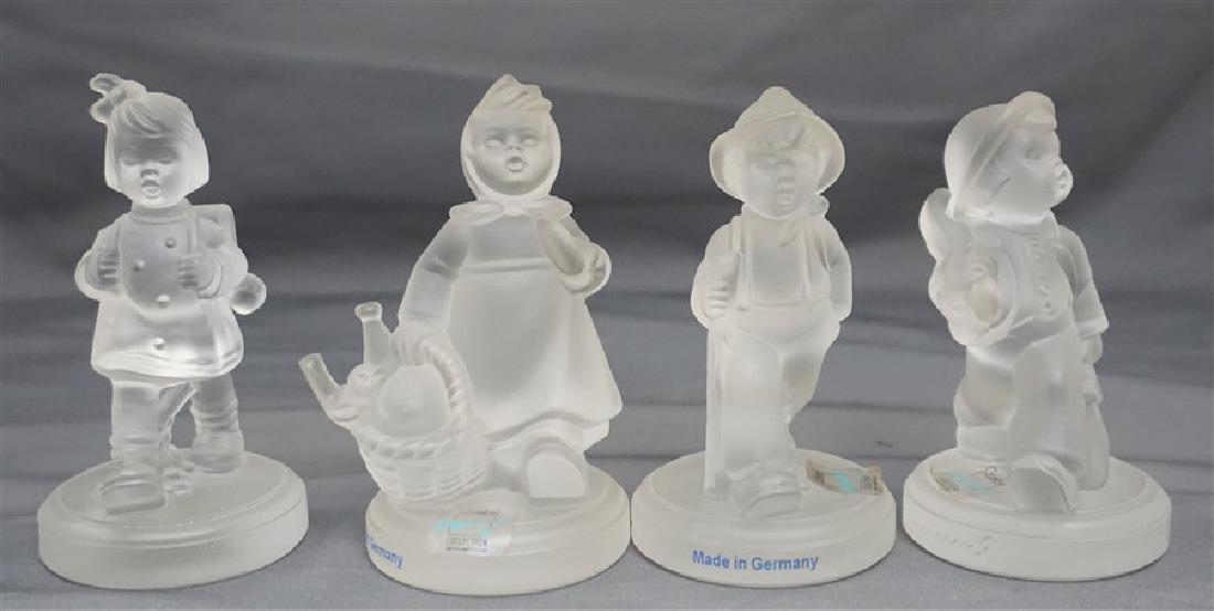 4 CRYSTAL M.I. HUMMEL FIGURINES: Four Crystal M.I. Hummel Figurines by Goebel. All in good condition. All with original stickers. All approximately 3.50" to 4" tall Weight on all 1 pd 9 oz.