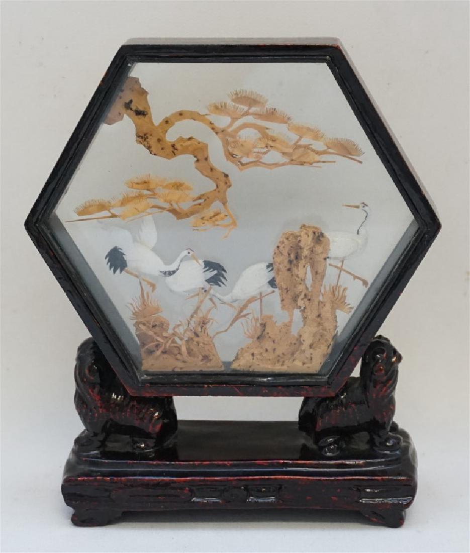 CHINESE CARVED CORK SCULPTURE CRANES: Vintage 1940s Chinese Cork Carving Diorama with delicate Cranes and trees in a black and red lacquered hardwood frame supported by two Foo Dogs on base. Measures 5"x2"x6.75". Weight 9 oz. PROVENANCE: