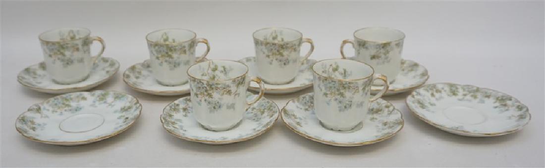 14 PC ANTIQUE LIMOGES DEMITASSE: 14 Piece, 8 Saucers, 6 Cups, Antique late 19th c. A. Lanternier Porcelain Demitasse Set. The pattern has delicate blue forget-me-nots on both the outside and inside. Cups 2,25". Saucers 4.75". Weight 