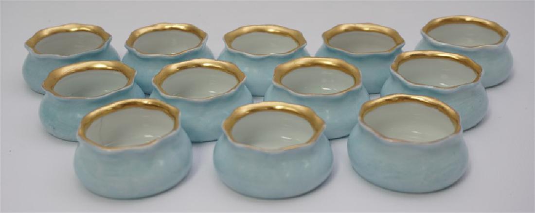 12 ROBINS EGG BLUE GILDED PORCELAIN SALTS: 12 Robins Egg Blue Gilded Porcelain Salt Cellars by Oscar & Edgar Gutherz, Royal, Austria. With the hallmark used from 1898 to 1918. Each 2"x2"x3/4". Good condition. Weight 1 pd. Maximilian Marx and O