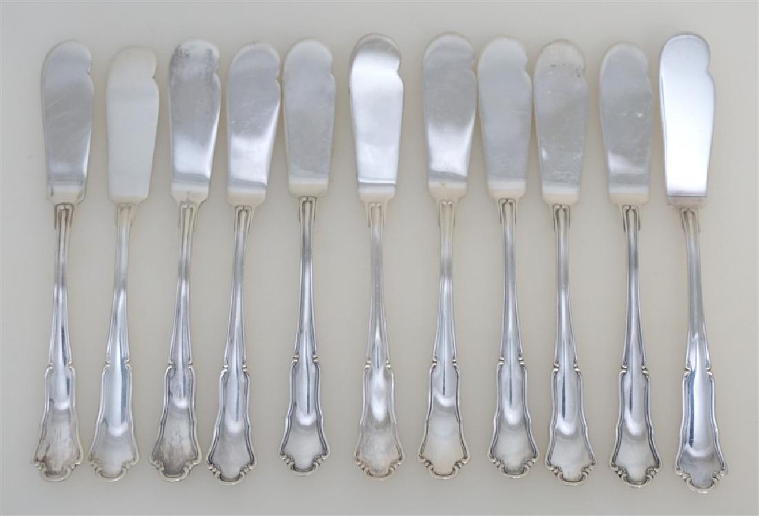 11 BUCCELLATI SAVOY STERLING BUTTER SPREADER: Eleven Buccellati Sterling Silver Flat Handle Butter Spreader in the Savoy Pattern featuring elegant scrolled edge. In excellent condition. The Savoy collection is made in Italy by the 18th-century ho