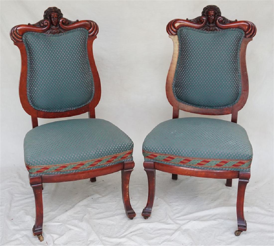 2 RENAISSANCE REVIVAL CARVED CHAIRS: Pair of Exceptional Renaissance Revival Upholstered Carved Parlor / Side Chairs. Carved Mask Crests, Upholstered Backs and overstuffed seats. Newer brocade upholstery, original castors. Very good cond