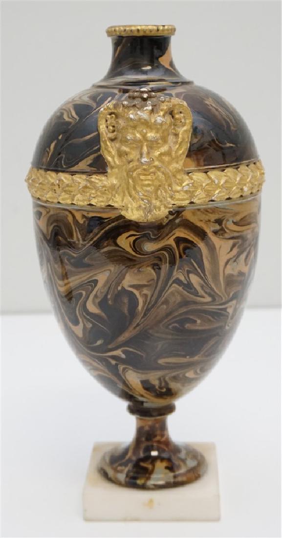 WEDGWOOD & BENTLEY C. 1765 URN: Antique 18th c. Wedgwood & Bentley agate ware vase decorated with one molded and gilded horned bacchus head accent and laurel leaf trim. Mounted to marble base, missing top. Measures 4 1/2"x4 1/2"x10"