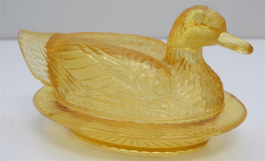WESTMORELAND AMBER GLASS DUCK: Westmoreland Amber Glass Duck on a Nest. Good condition. Measures 10"x6"x5". Weight 3 pds.