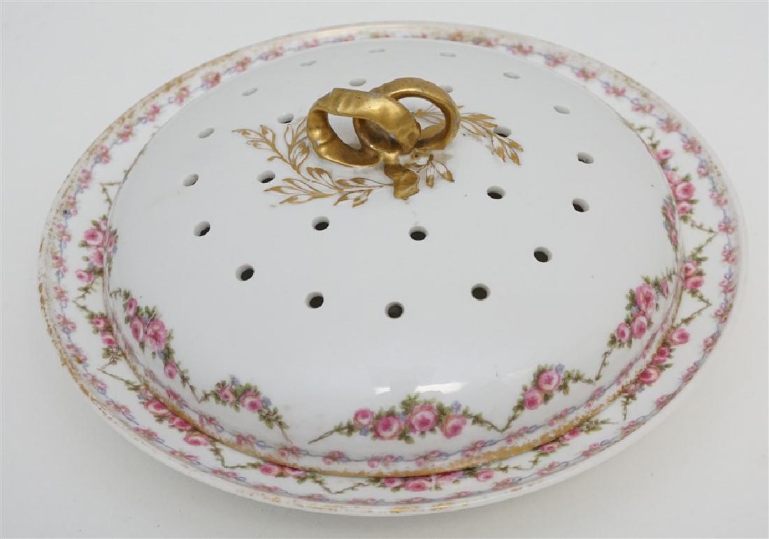 G.D.A. LIMOGES COVERED PANCAKE SERVER: Antique G.D.A. Gerard Dufraisseix & Abbot Limoges Covered Pancake Serving Dish with pierced lid. Hand painted delicate pink rose swags , gilt trim and gilt ribbon finale. Very good condition. A elegan