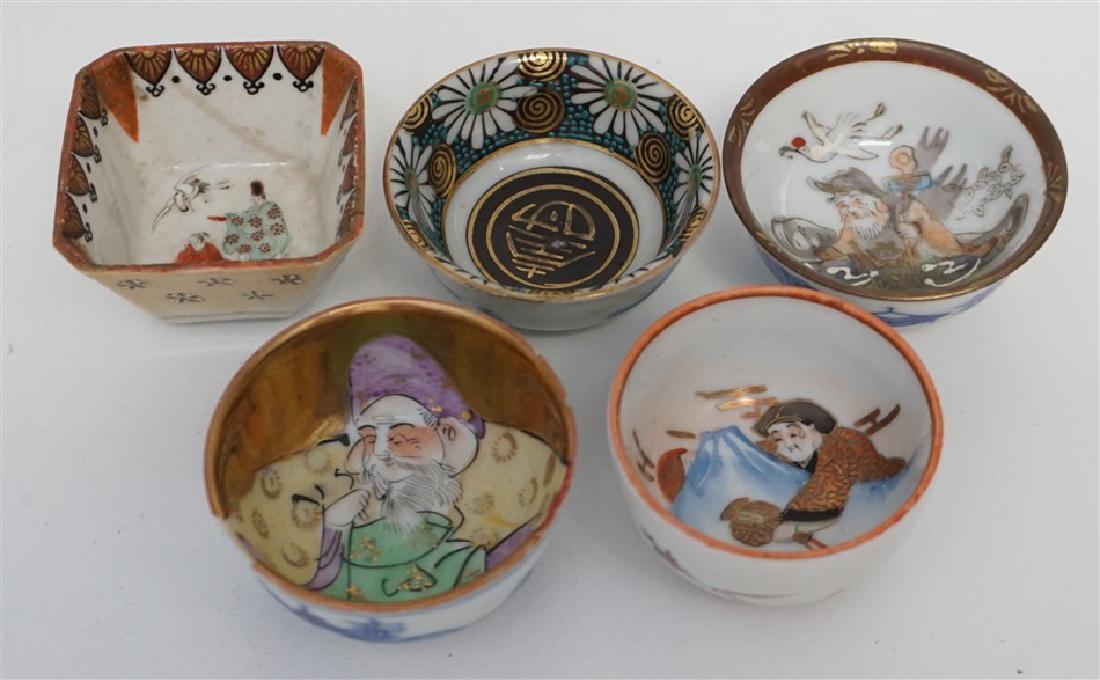 5 ANTIQUE KUTANI CEREMONIAL SAKE CUPS: Five Antique Japanese Fine Kutani Porcelain Ceremonial Sake Cups. All are signed. 3 in very good condition, tiny nick to one rim- gilt Hotei, very old Square one with hairlines. Weight on all 6 oz. PR