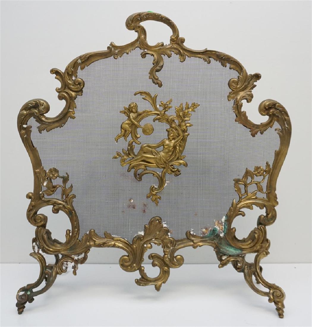 FRENCH LOUIS XVI BRASS FIREPLACE SCREEN: Antique French Louis XVI Style brass fireplace screen, having scrolling foliate decoration and a cherub fanning a reclining semi nude woman in the centre. Measures 25"x9"x29-1/2". Approximately 16 pds