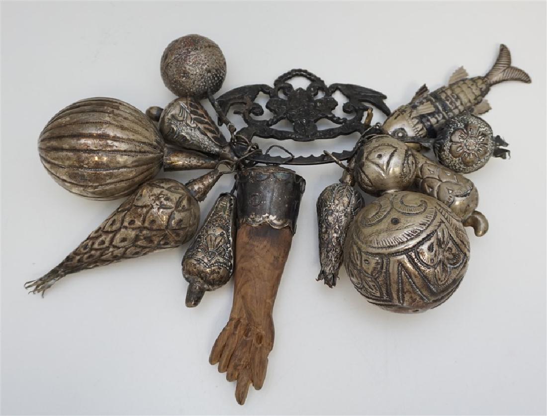 TURKISH SILVER GATE / DOOR CHARMS: Large group of hammered silver symbols from Turkey in a cluster on a iron holder for garden gate or house. There is the fig sign carved from wood. Measures 8"x5"x11". Weight 1 pd 6 oz. PROVENANCE: Cha