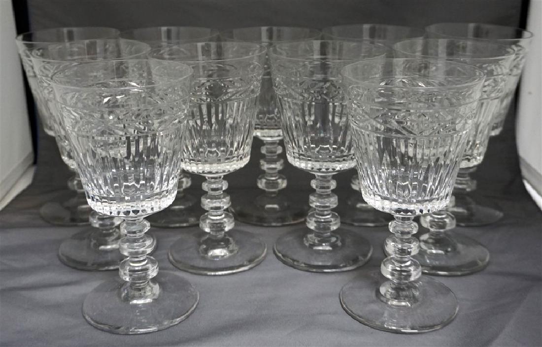 11 CONTEMPORARY CRYSTAL GLASSES: 11 Contemporary Crystal Wine Glasses. Graduated notched stems. Each measures 3 1/4"x3 1/4"x6 1/4". Weight on all 9 pds. PROVENANCE: A Private Charleston SC Estate.